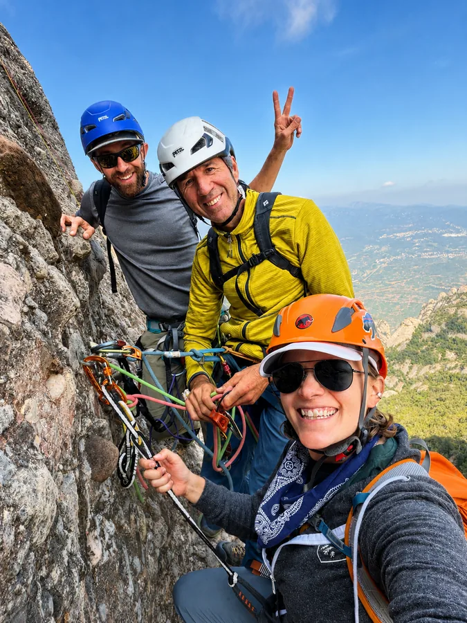 Montserrat. A rope team and their guide at an anchor high on Gorro Frigi.