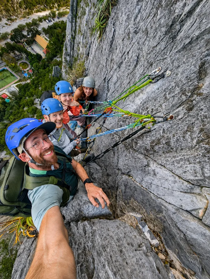Rope teams of two climbers and one guide, and now and then everyone at the same anchor.